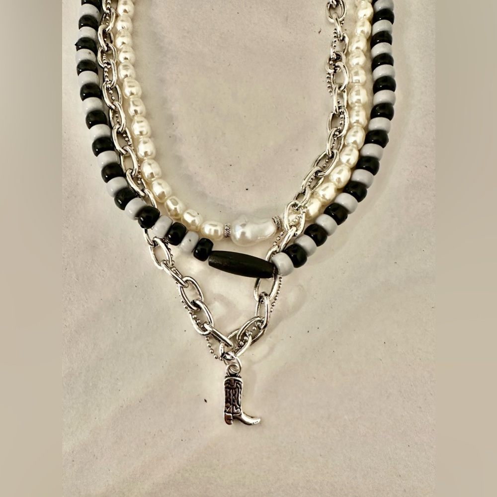 Free people black/ white cowboy boot necklace. New with tags.